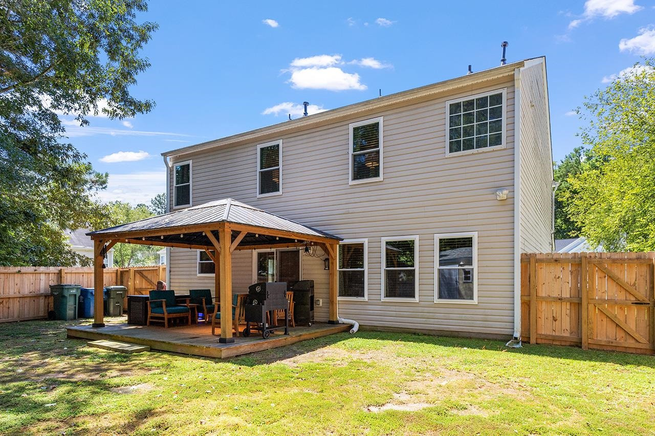 6 Esterbrook Court Durham, NC 27703 - Photo 29 of 31 a view of a house with floor to ceiling windows and a basket ball poll