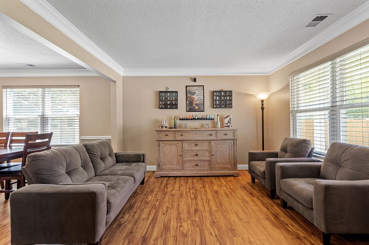 6 Esterbrook Court Durham, NC 27703 - Photo 5 of 31 a living room with furniture and a large window