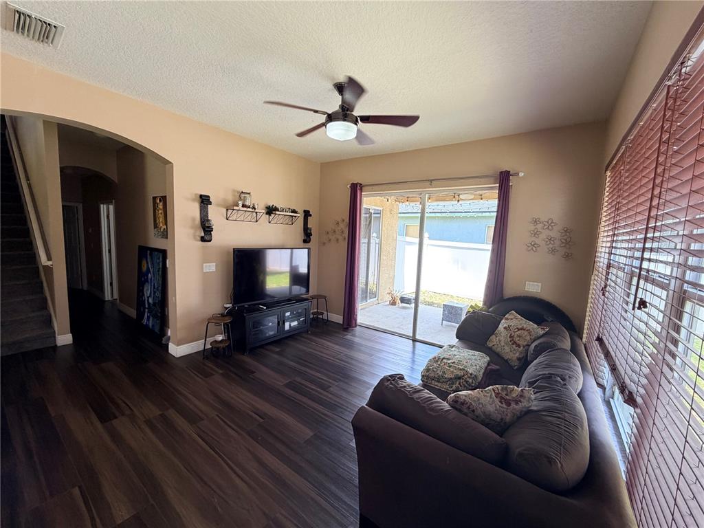 13250 Mandalay Place Spring Hill, FL 34609 - Photo 6 of 28 a living room with furniture and a flat screen tv