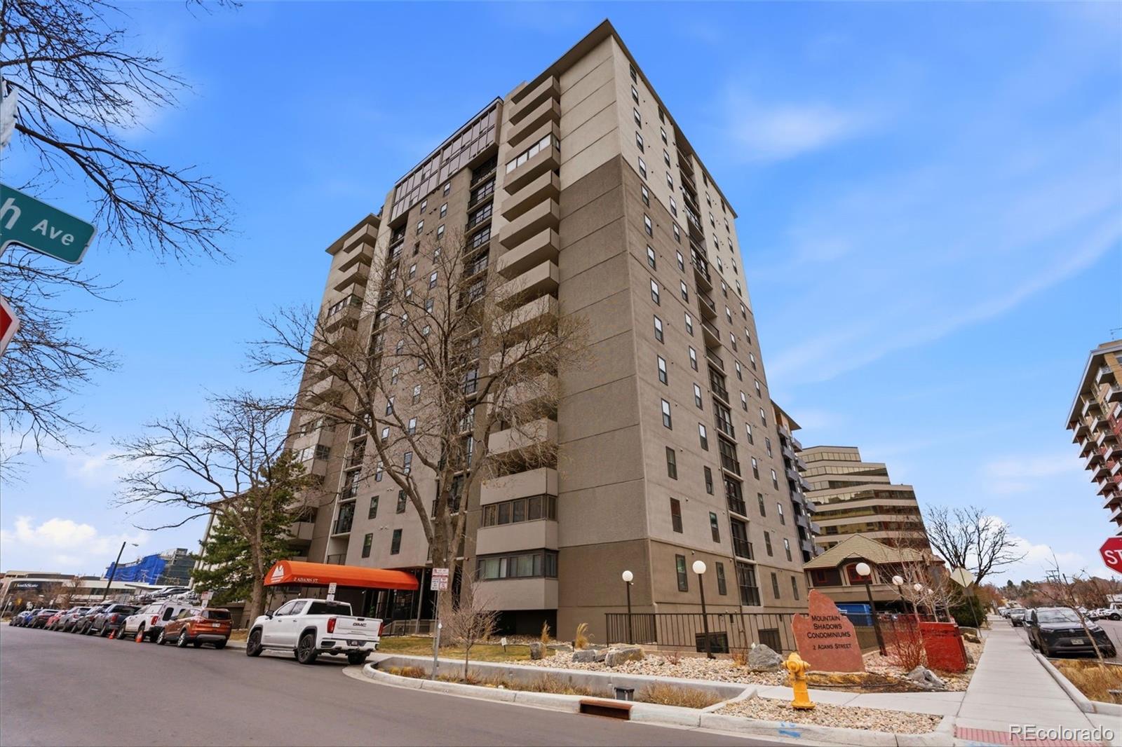 2 Adams Street, Unit 105 Denver, CO 80206 - Photo 13 of 50 a view of a tall building next to a road