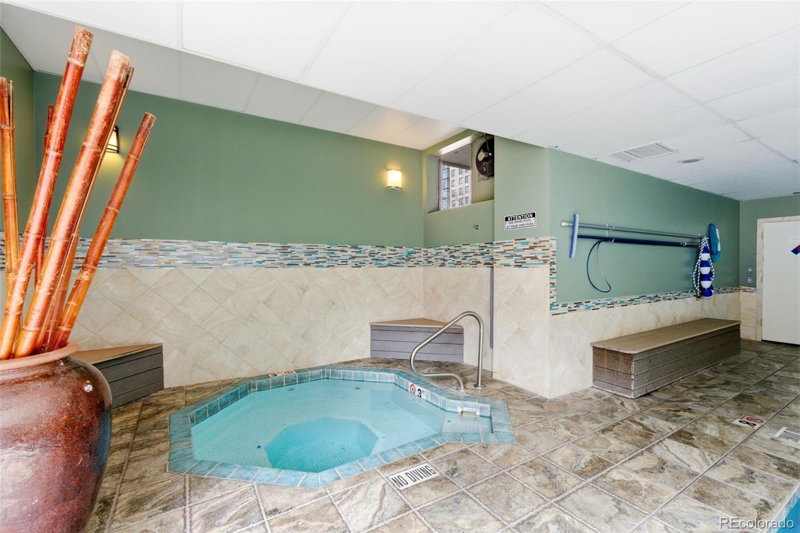 2 Adams Street, Unit 105 Denver, CO 80206 - Photo 21 of 50 a bathroom with a sink and a mirror
