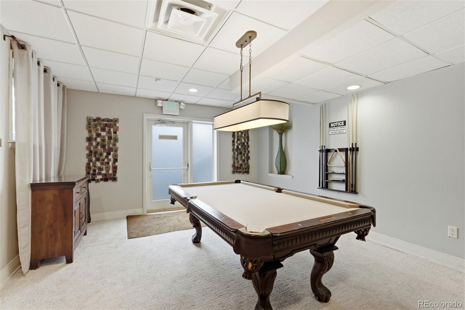 2 Adams Street, Unit 105 Denver, CO 80206 - Photo 24 of 50 a room with pool table and windows