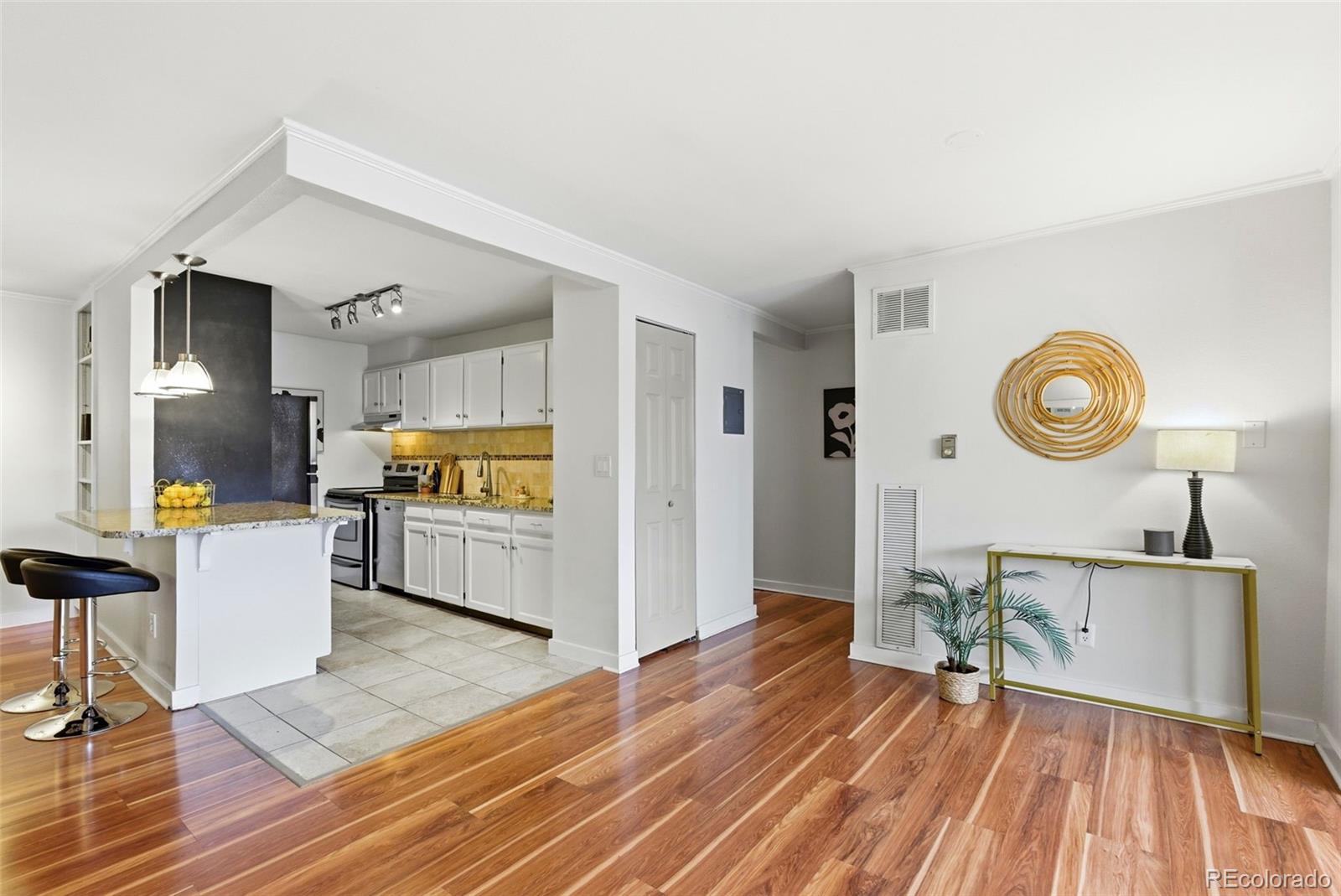 2 Adams Street, Unit 105 Denver, CO 80206 - Photo 8 of 50 a view of a living room and a wooden floor