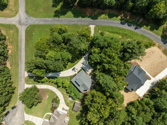 an aerial view of residential house with outdoor space and swimming pool