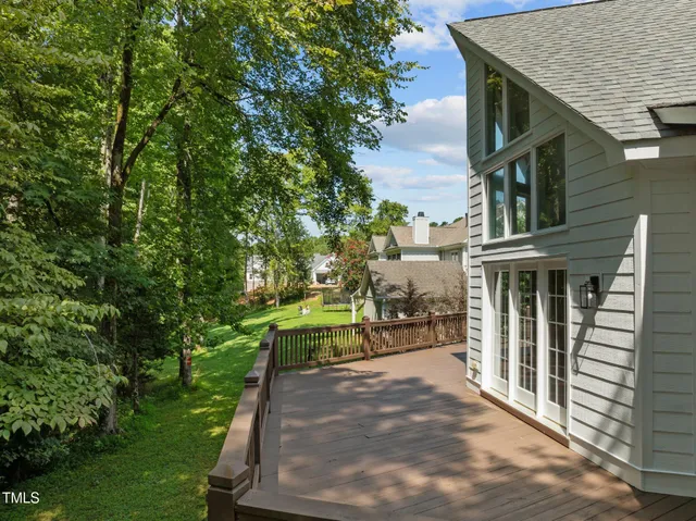 a view of house with backyard space and garden