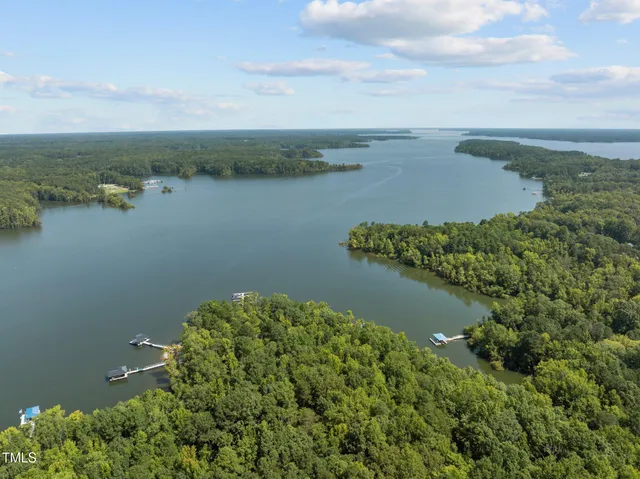 an aerial view of a houses with ocean view