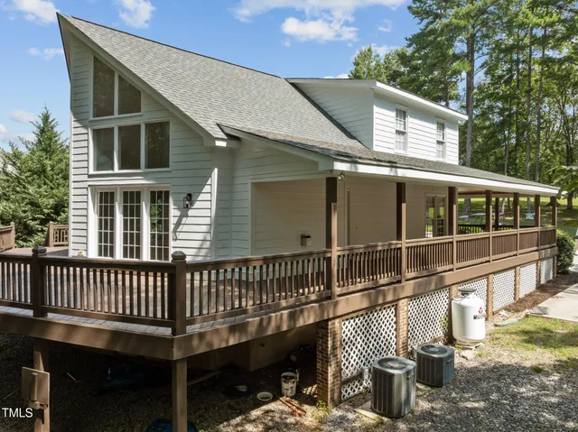 a balcony with table and chairs