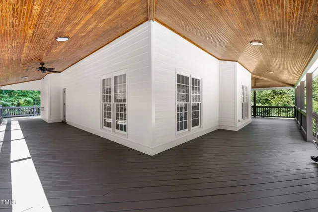a view of balcony with wooden floor