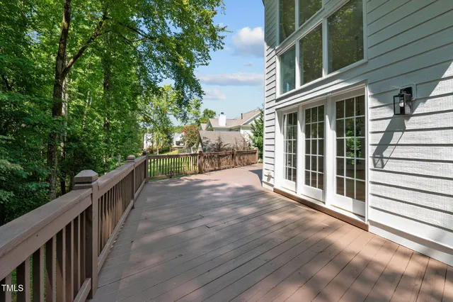 a view of a balcony with tree