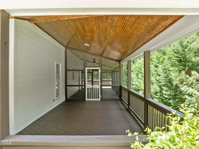 a view of a balcony with chairs