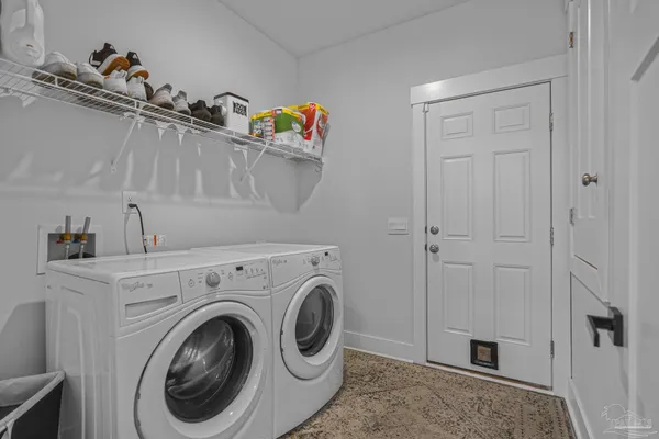 a view of storage and utility room with racks on the wall