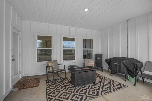 a living room with furniture and a window