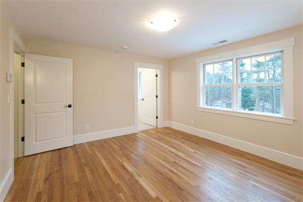 181 Alcott Road Concord, MA 01742 - Photo 16 of 26 a view of an empty room with wooden floor and a window