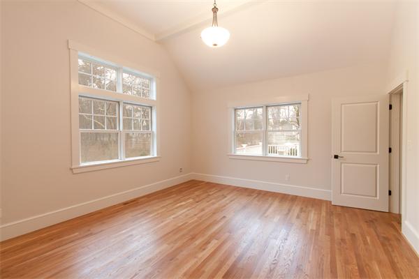 181 Alcott Road Concord, MA 01742 - Photo 21 of 26 a view of an empty room with wooden floor and a window