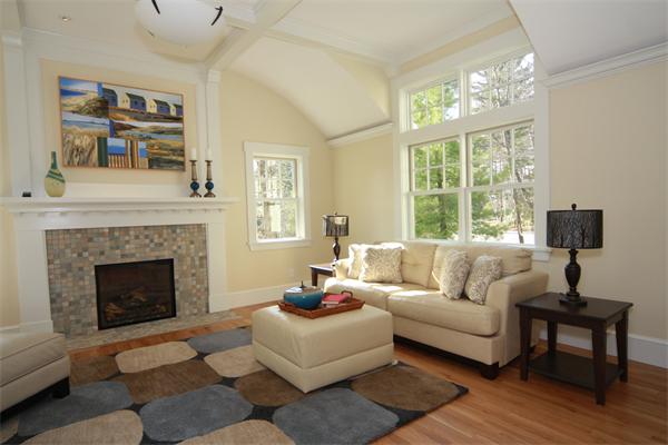 181 Alcott Road Concord, MA 01742 - Photo 9 of 26 a living room with furniture and a fireplace