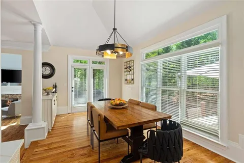 a living room with furniture fireplace and window