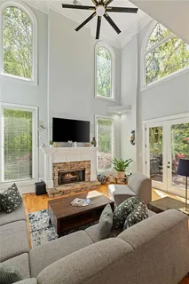 a bathroom with a granite countertop sink mirror and a bath tub