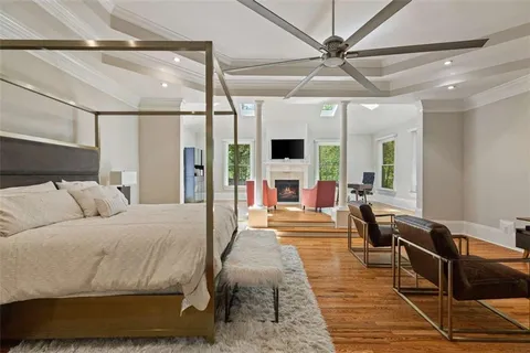 a bathroom with a toilet sink vanity and mirror