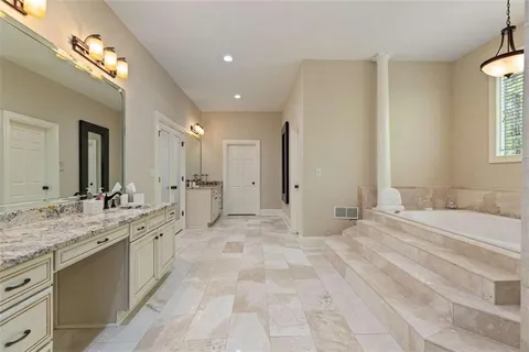 a bathroom with a sink vanity granite and toilet