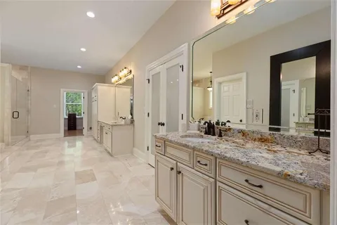 a bed room with a bed and a ceiling fan