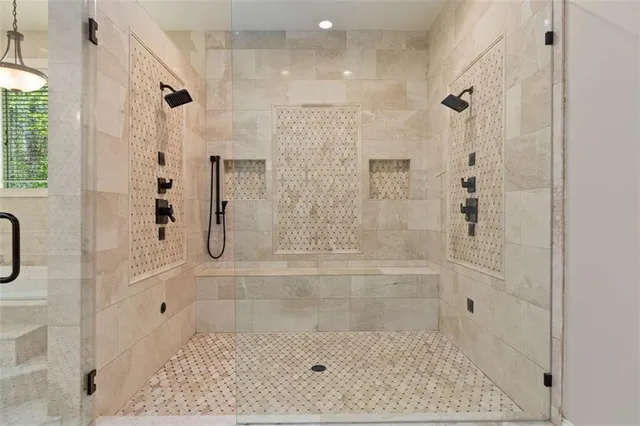 a kitchen with refrigerator and cabinets