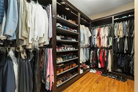 a view of an empty room with floor to ceiling window