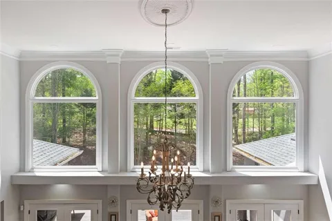 a view of a patio with a table and chairs under an umbrella