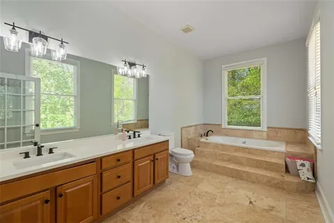 an outdoor sitting area with furniture and wooden deck