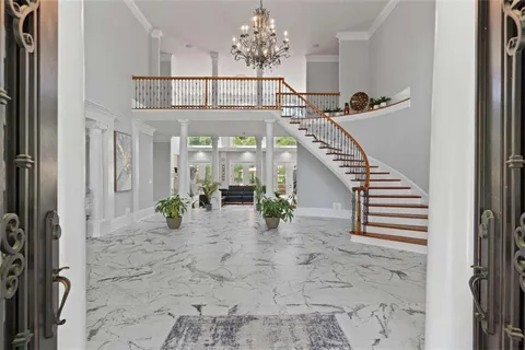 a living room with furniture a fireplace and a window