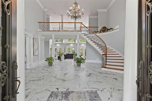 a living room with furniture a fireplace and a window
