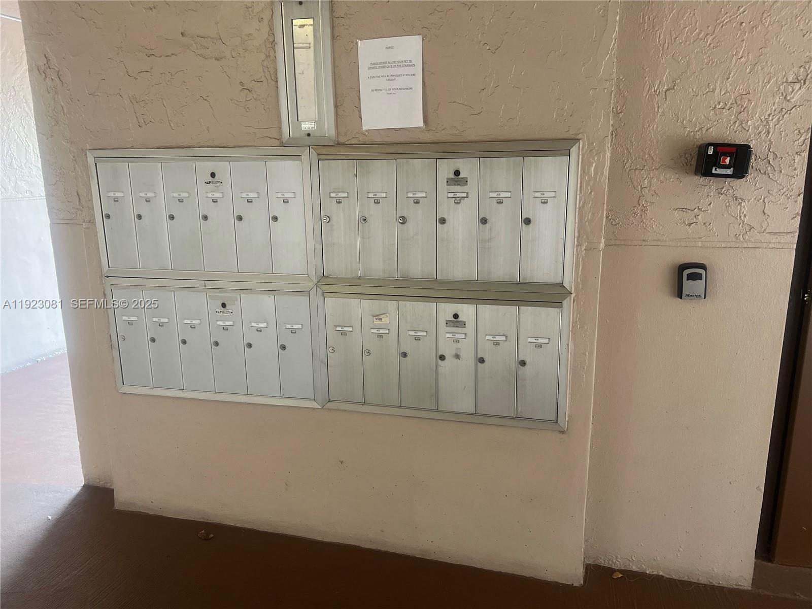 9510 Seagrape Drive, Unit 101 Davie, FL 33324 - Photo 5 of 18 a view of a wooden door