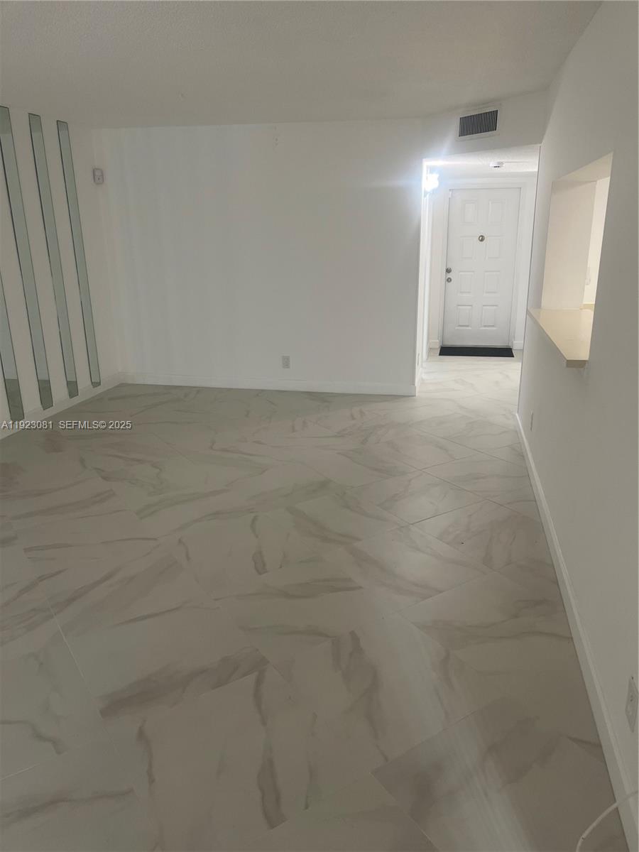 9510 Seagrape Drive, Unit 101 Davie, FL 33324 - Photo 9 of 18 a view of an empty room