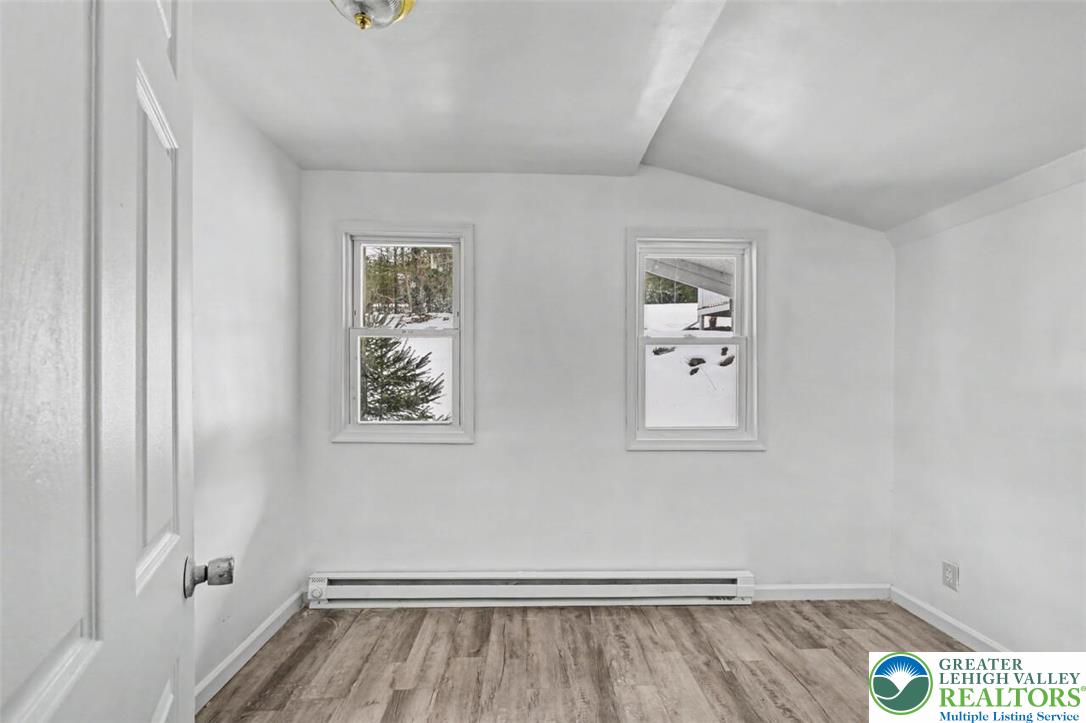 108 Mink Lane Bushkill, PA 18324 - Photo 16 of 33 a view of room with window and wooden floor