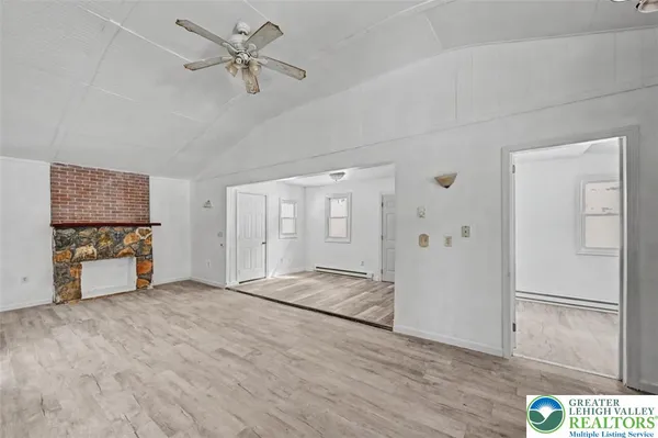 a view of livingroom with hardwood floor and a ceiling fan