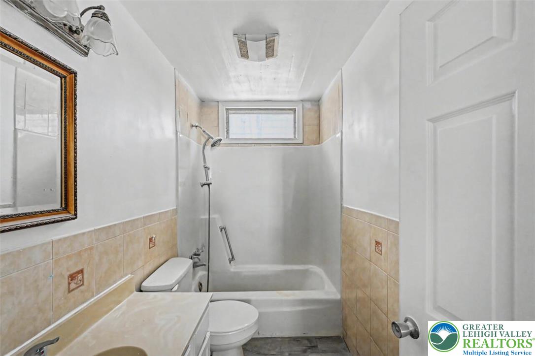 108 Mink Lane Bushkill, PA 18324 - Photo 25 of 33 a bathroom with a sink a toilet and shower