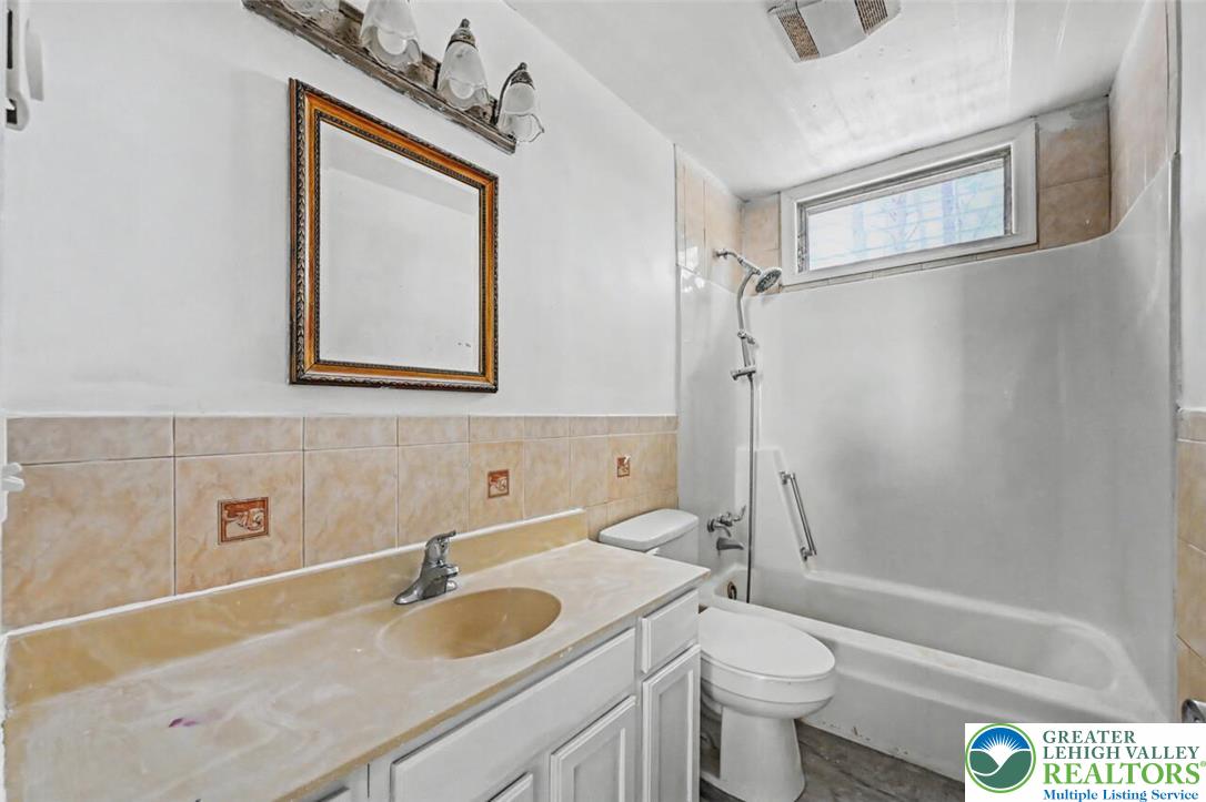 108 Mink Lane Bushkill, PA 18324 - Photo 30 of 33 a bathroom with a granite countertop sink toilet and shower