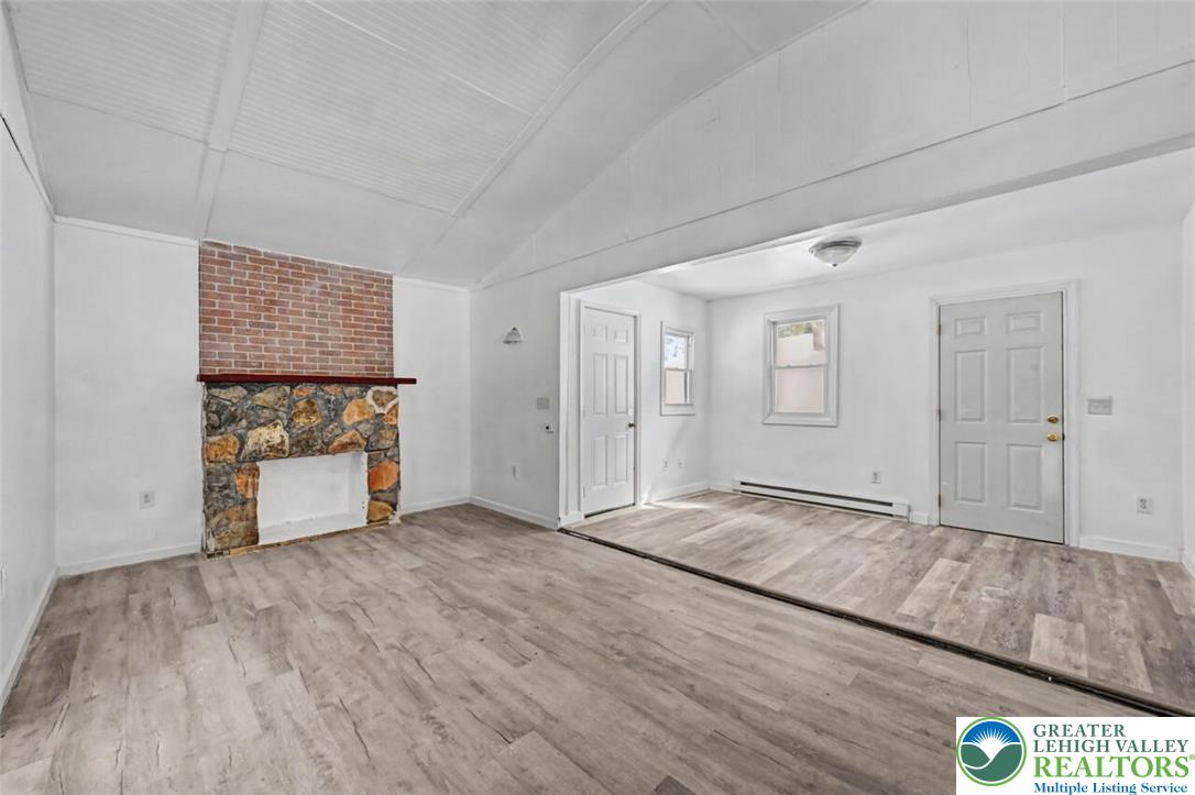108 Mink Lane Bushkill, PA 18324 - Photo 4 of 33 a view of an empty room with kitchen and window