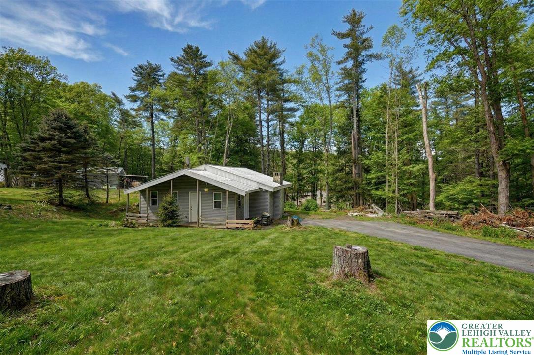108 Mink Lane Bushkill, PA 18324 - Photo 8 of 33 a view of a house with a yard