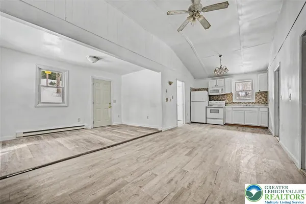 a view of a kitchen with a sink cabinets and window