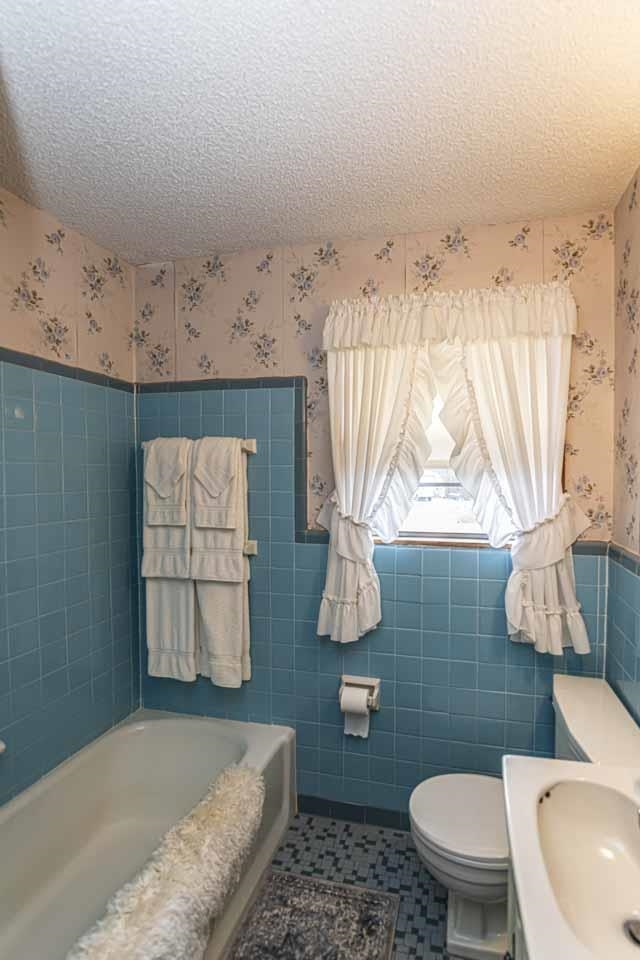 3285 Munford Giltedge Road Drummonds, TN 38023 - Photo 19 of 32 a bathroom with a toilet sink and mirror