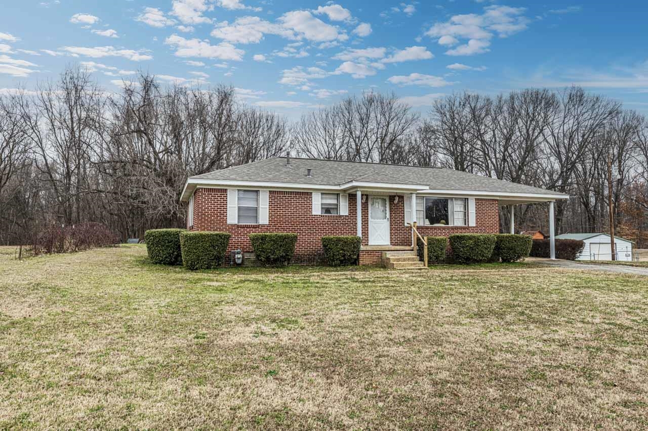 3285 Munford Giltedge Road Drummonds, TN 38023 - Photo 30 of 32 a view of a house with a yard