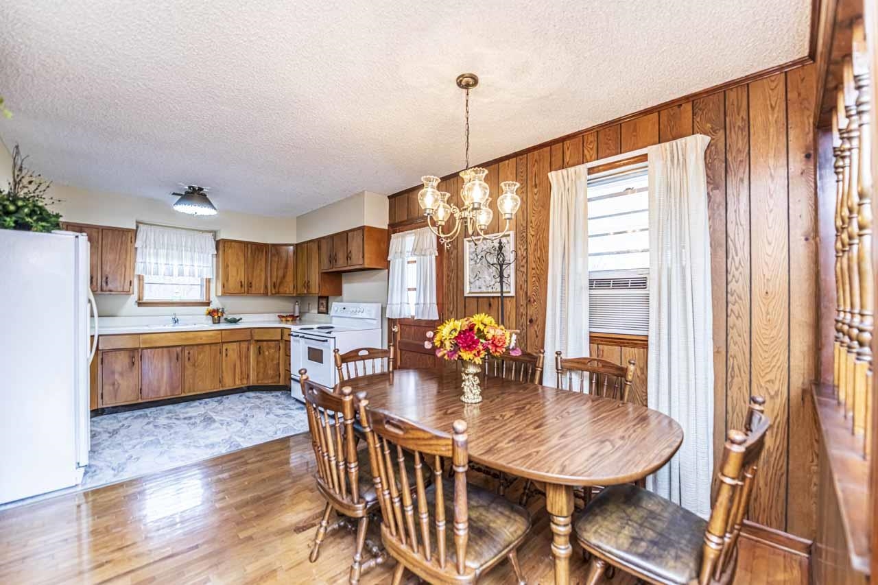 3285 Munford Giltedge Road Drummonds, TN 38023 - Photo 8 of 32 a kitchen with stainless steel appliances kitchen island granite countertop a dining table chairs and sink