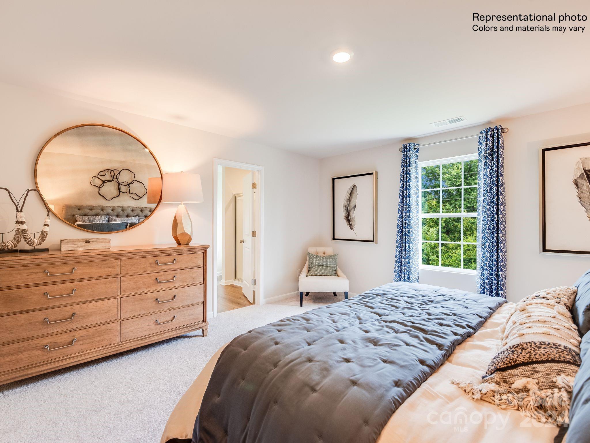 13228 Hampton Bay Lane Charlotte, NC 28262 - Photo 13 of 25 a bedroom with a bed and a dresser