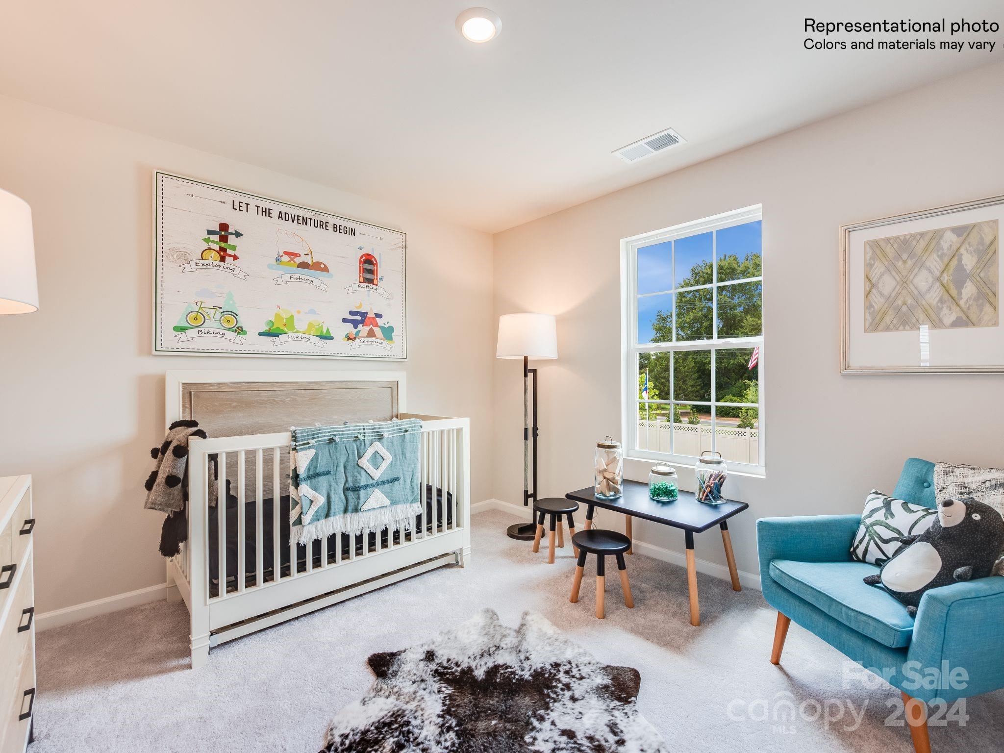 13228 Hampton Bay Lane Charlotte, NC 28262 - Photo 17 of 25 a bedroom with furniture and a book shelf