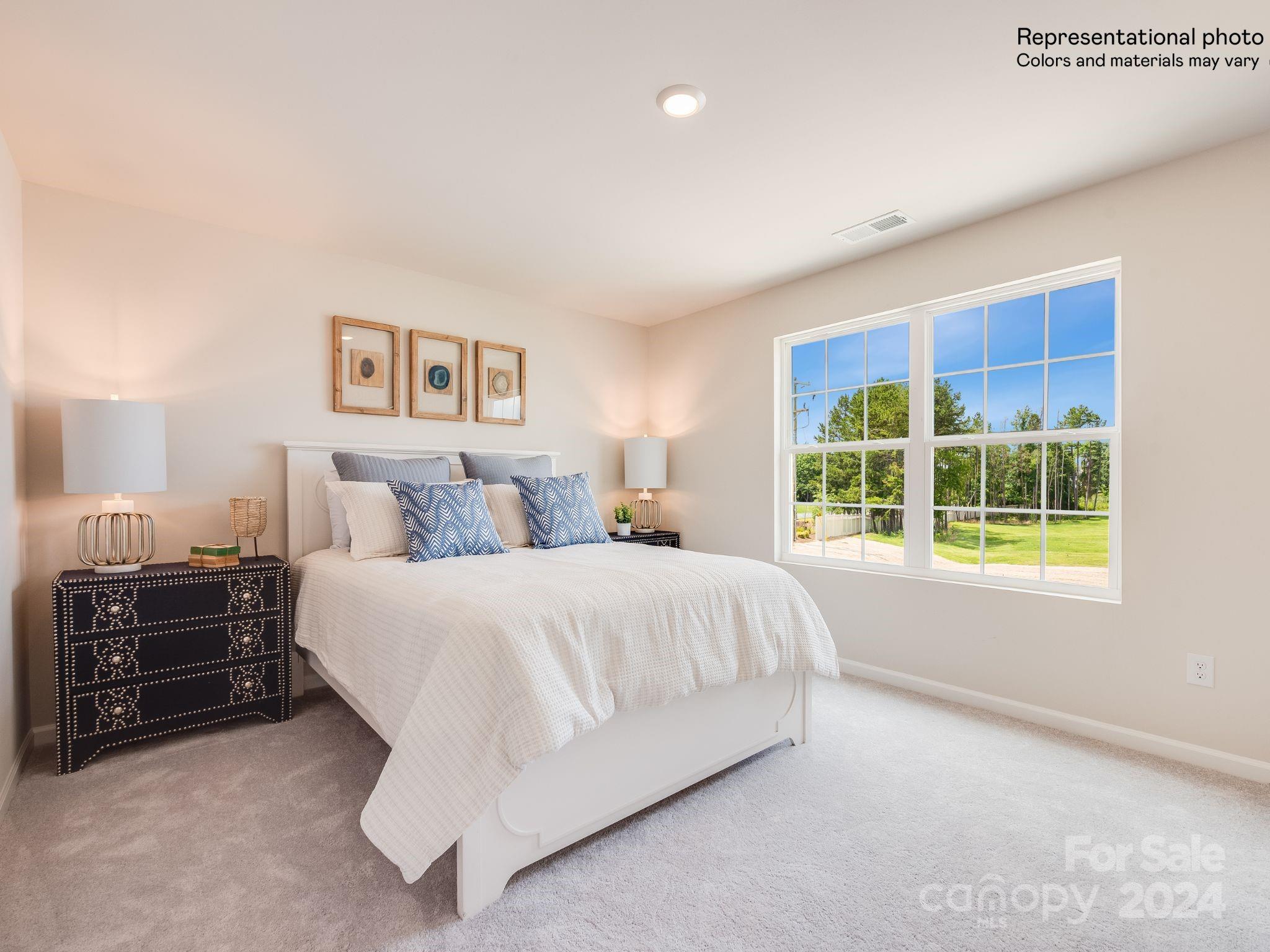 13228 Hampton Bay Lane Charlotte, NC 28262 - Photo 20 of 25 a spacious bedroom with a bed and dresser