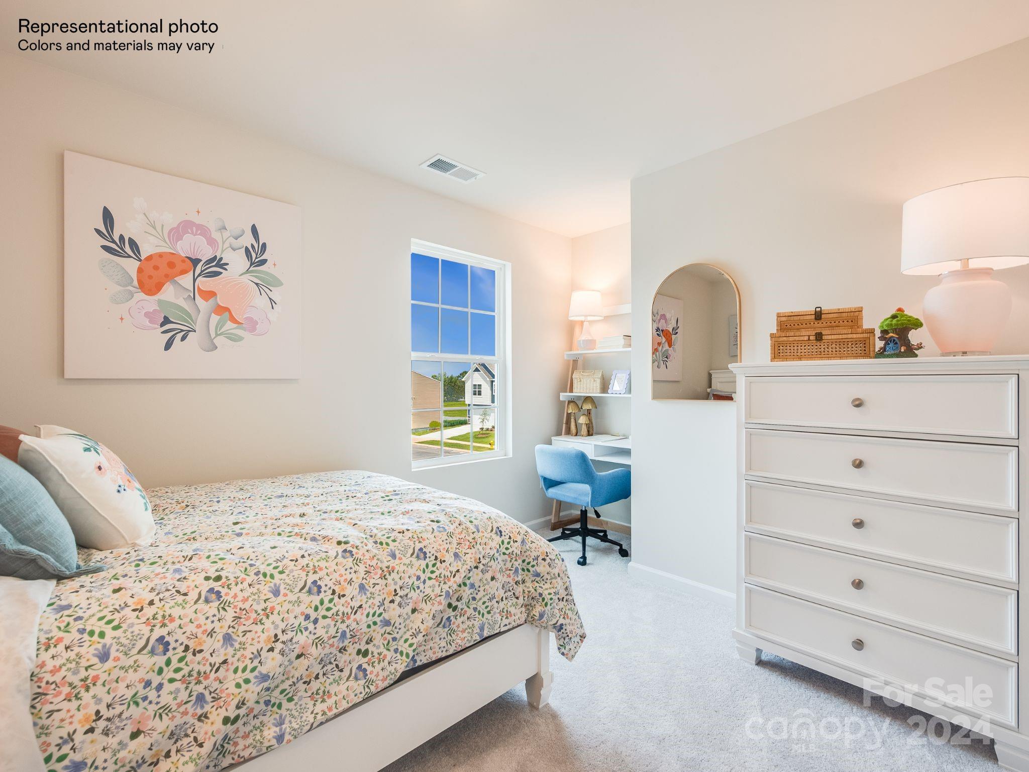 13228 Hampton Bay Lane Charlotte, NC 28262 - Photo 22 of 25 a bedroom with a bed and a painting on the wall