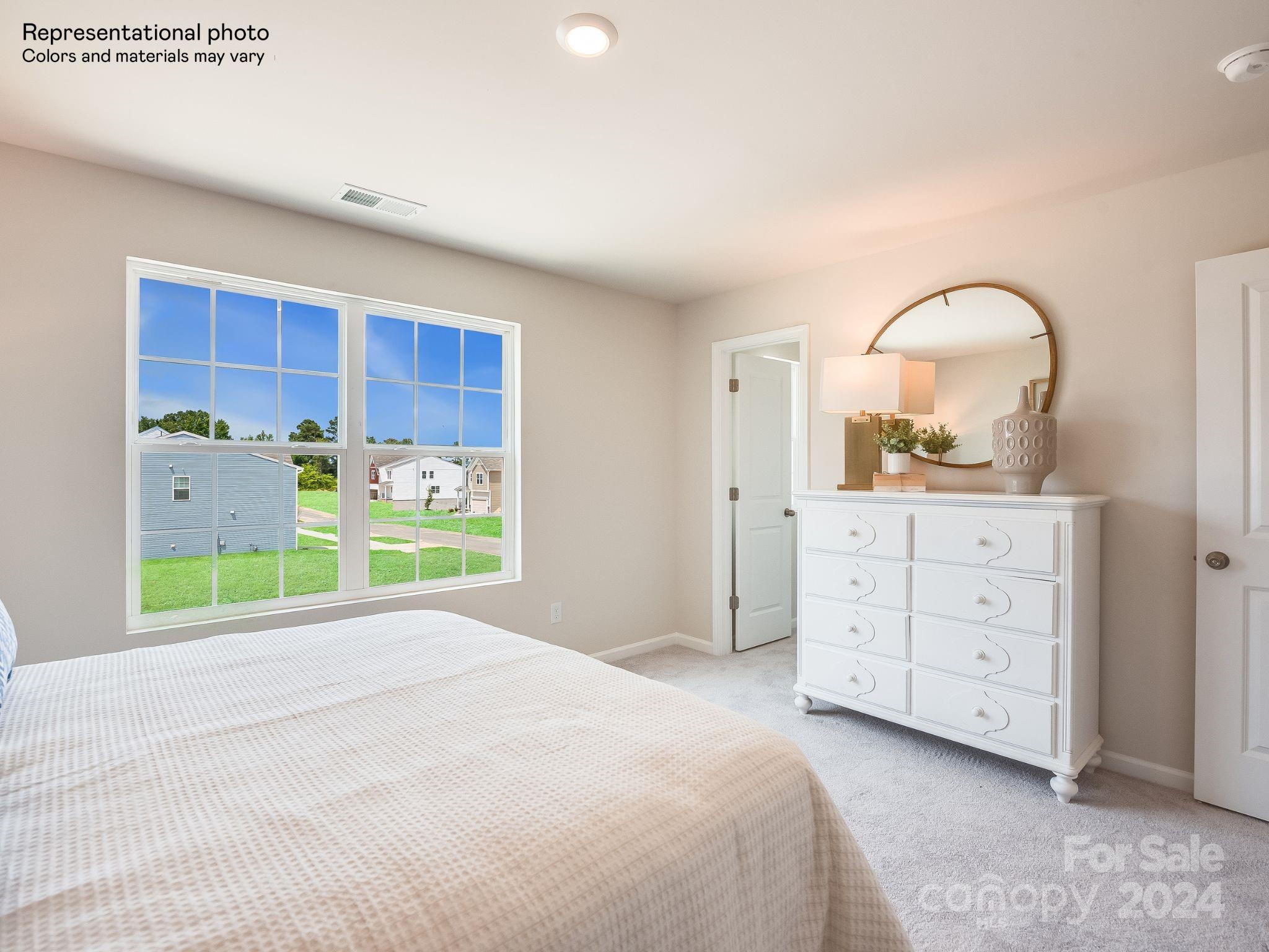 13228 Hampton Bay Lane Charlotte, NC 28262 - Photo 23 of 25 a bedroom with a bed and a dresser