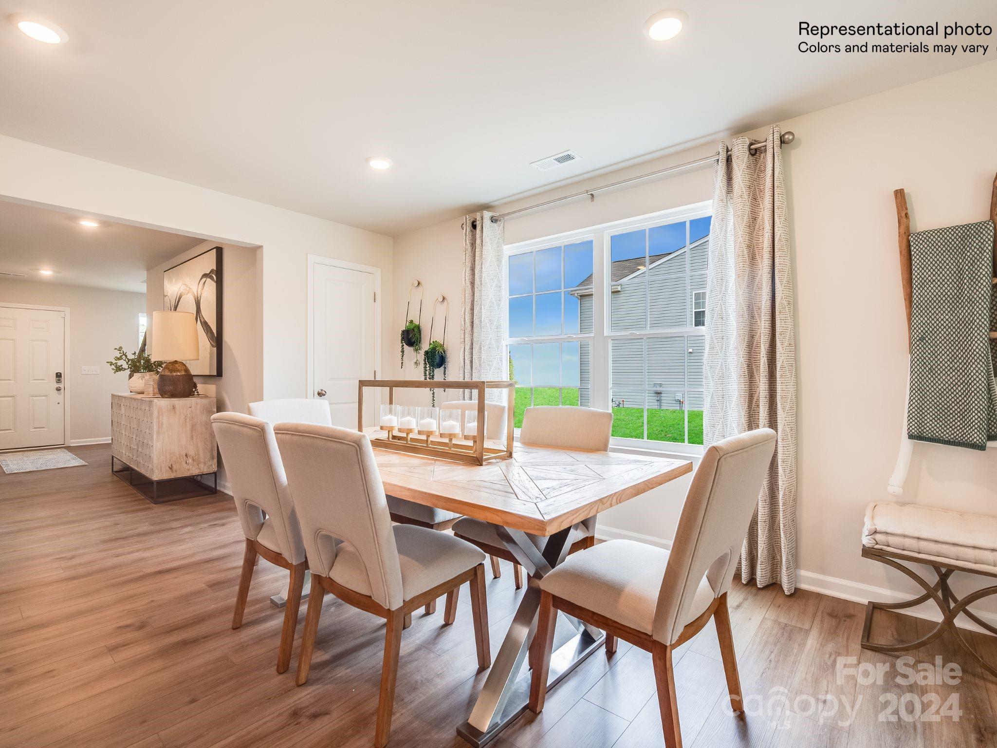 13228 Hampton Bay Lane Charlotte, NC 28262 - Photo 7 of 25 a view of a dining room with furniture and a table