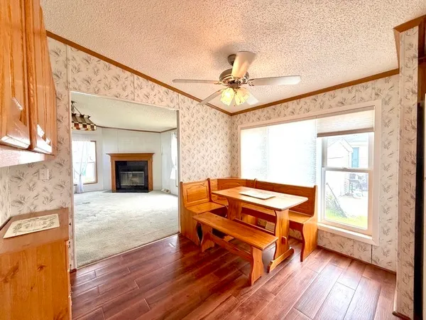 a living room with a flat screen tv and a fireplace