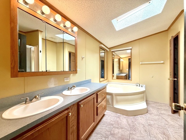 9 Swallow Lane Beecher, IL 60401 - Photo 17 of 20 a en suite bathroom with a double vanity sink mirror and